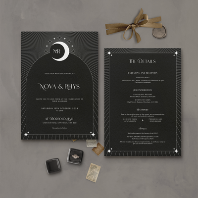 Wedding stationery flatlay of black Aurora celestial invitation and information card designed by The Little Paper Shop