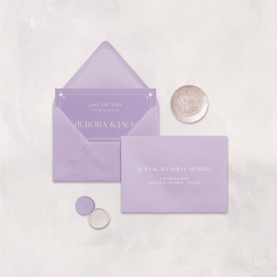 Wedding stationery flatlay with printed address on a lilac envelope designed by The Little Paper Shop