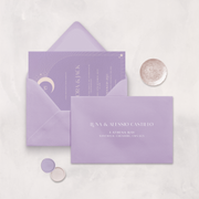 Wedding stationery flatlay with printed address on a lilac envelope designed by The Little Paper Shop