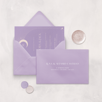 Wedding stationery flatlay with printed address on a lilac envelope designed by The Little Paper Shop