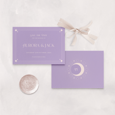 Wedding stationery flatlay of lilac Aurora celestial save the date card designed by The Little Paper Shop