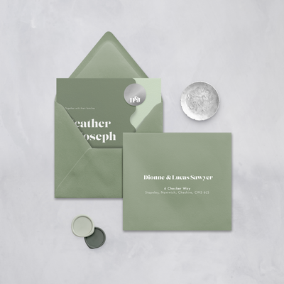 Wedding stationery flatlay with printed address on sage green envelope designed by The Little Paper Shop