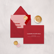 Wedding stationery flatlay with printed address on a red envelope designed by The Little Paper Shop