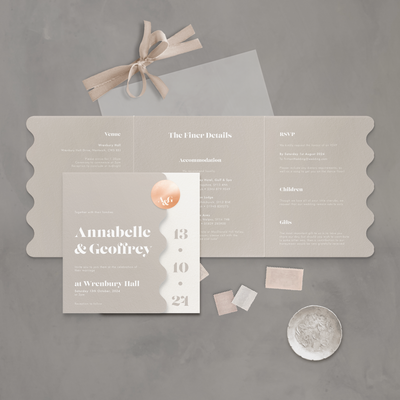 Neutral coloured Wedding stationery flatlay with wavy edge designed by The Little Paper Shop