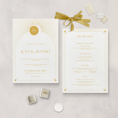 Wedding stationery flatlay of white and mustard Aurora celestial invitation and information card designed by The Little Paper Shop