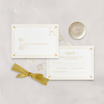 Wedding stationery flatlay of white and mustard celestial RSVP card designed by The Little Paper Shop