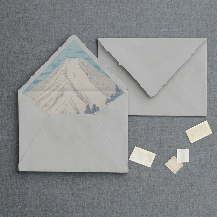 Lined neutral raw edge handmade paper envelope with mountain design liner. Designed by The Little Paper Shop