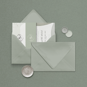 Wedding stationery flatlay including matching coloured address envelope upgrade designed by The Little Paper Shop