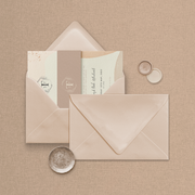 Wedding stationery flatlay including matching coloured address envelope upgrade designed by The Little Paper Shop