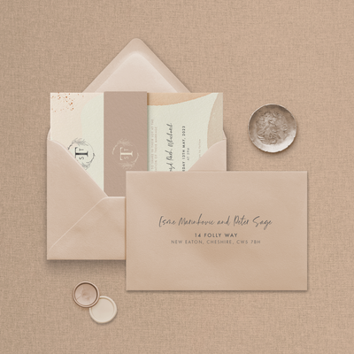 Wedding stationery flatlay including printed address envelope upgrade designed by The Little Paper Shop