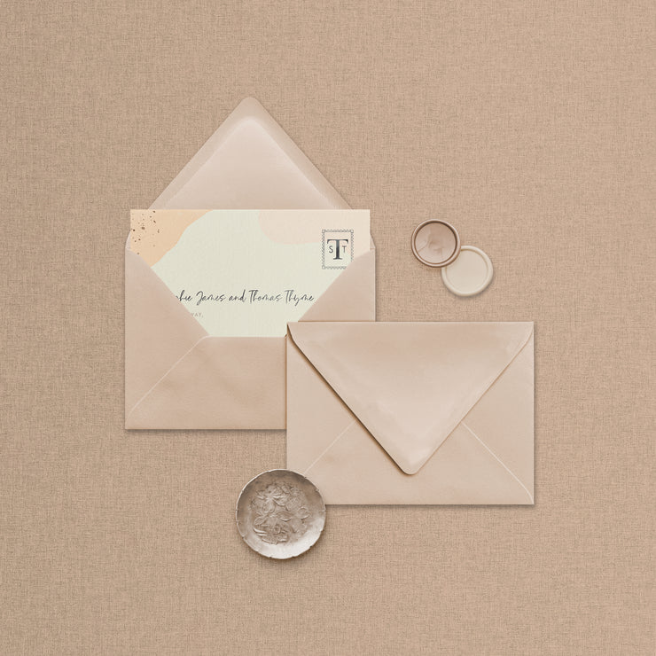 Wedding stationery flatlay including matching coloured address envelope upgrade designed by The Little Paper Shop